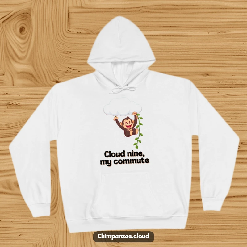 Funny chimpanzee character swinging joyfully from a cloud formation using a vine, looking utterly delighted and carefree in this cozy hoodie.