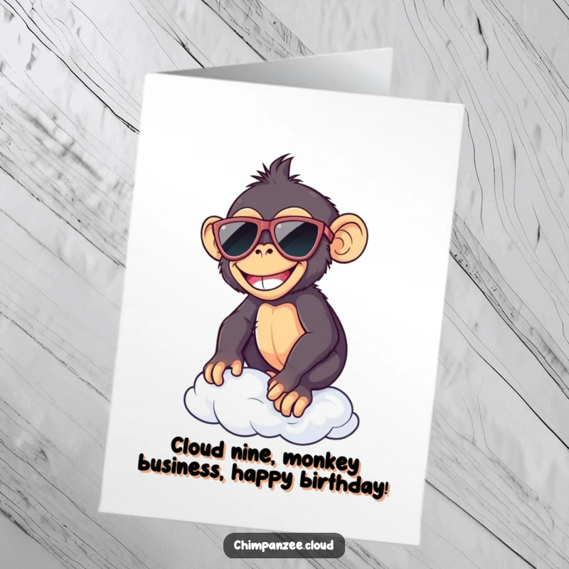 Funny Free Printable Birthday Card: Smiling chimp in sunglasses coolly balancing on a fluffy cloud, ready to party.