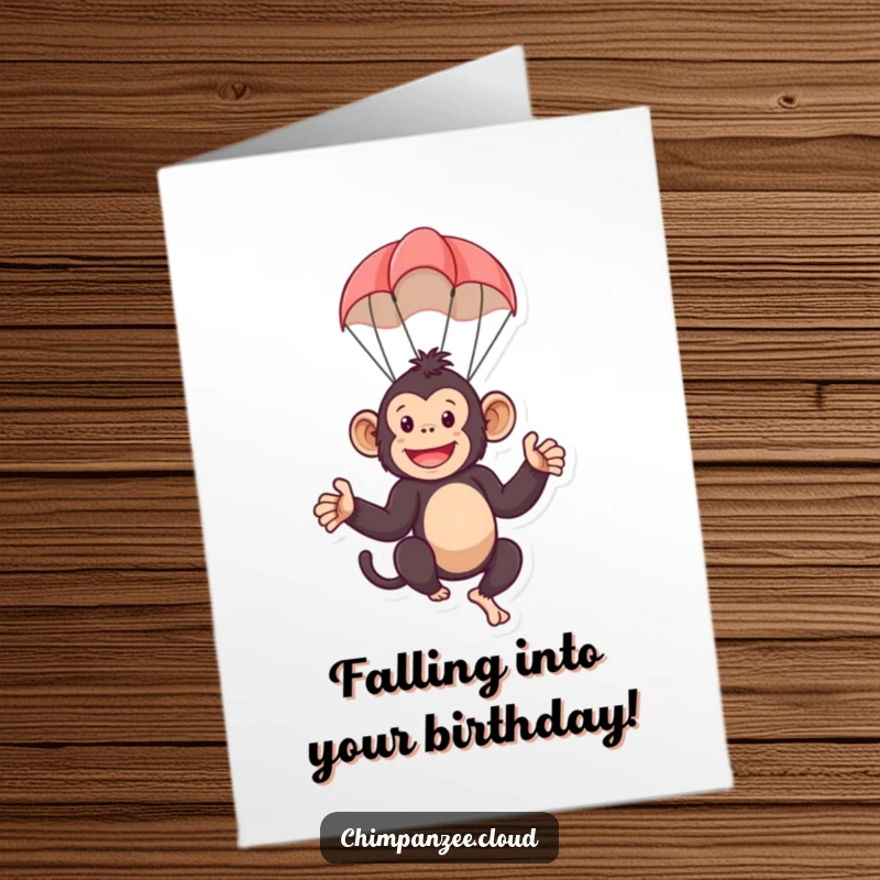 Funny Free Printable Birthday Card: A playful chimpanzee character floating down safely with a tiny parachute.